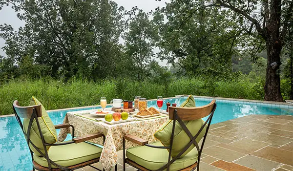 Poolside breakfast at Pench Tree Lodge